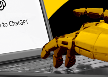 Mãos de um robô digitando em um notebook, que diz "Bem-vindo ao ChatGPT"